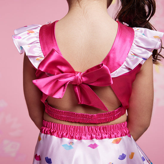 Open back design featuring oversized tie-back satin bow. – Speak Your Truth Collection