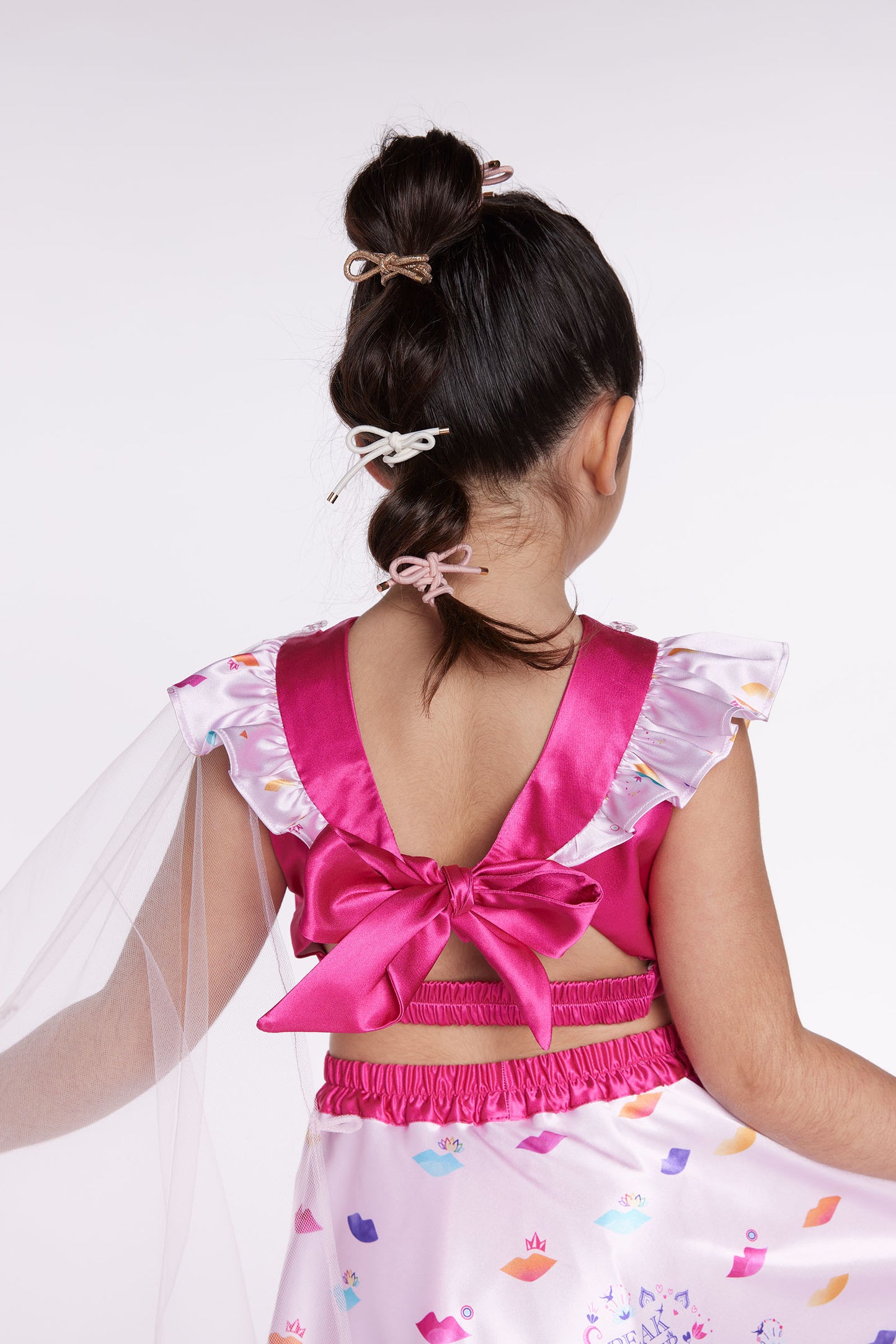 girl wearing pink lehenga party dress back close